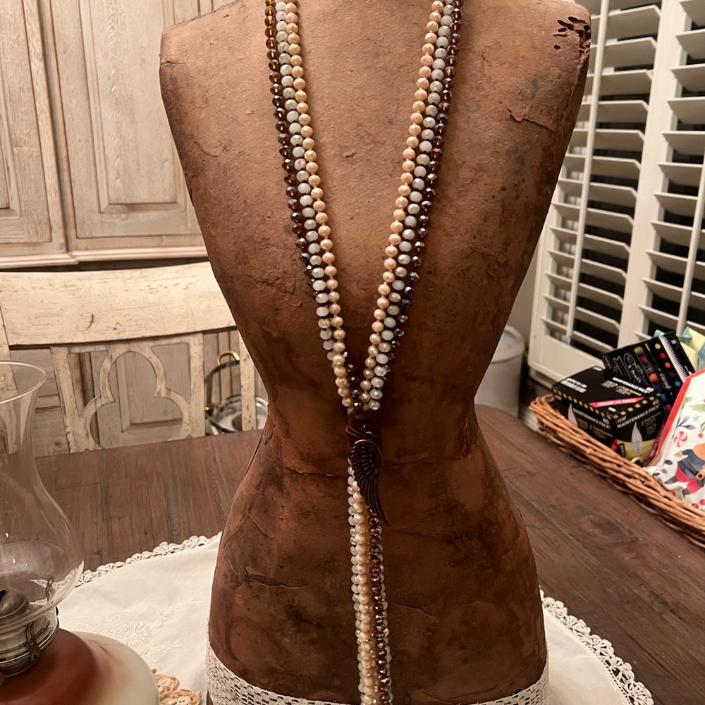 Elegant Beaded Necklace with Feather Pendant